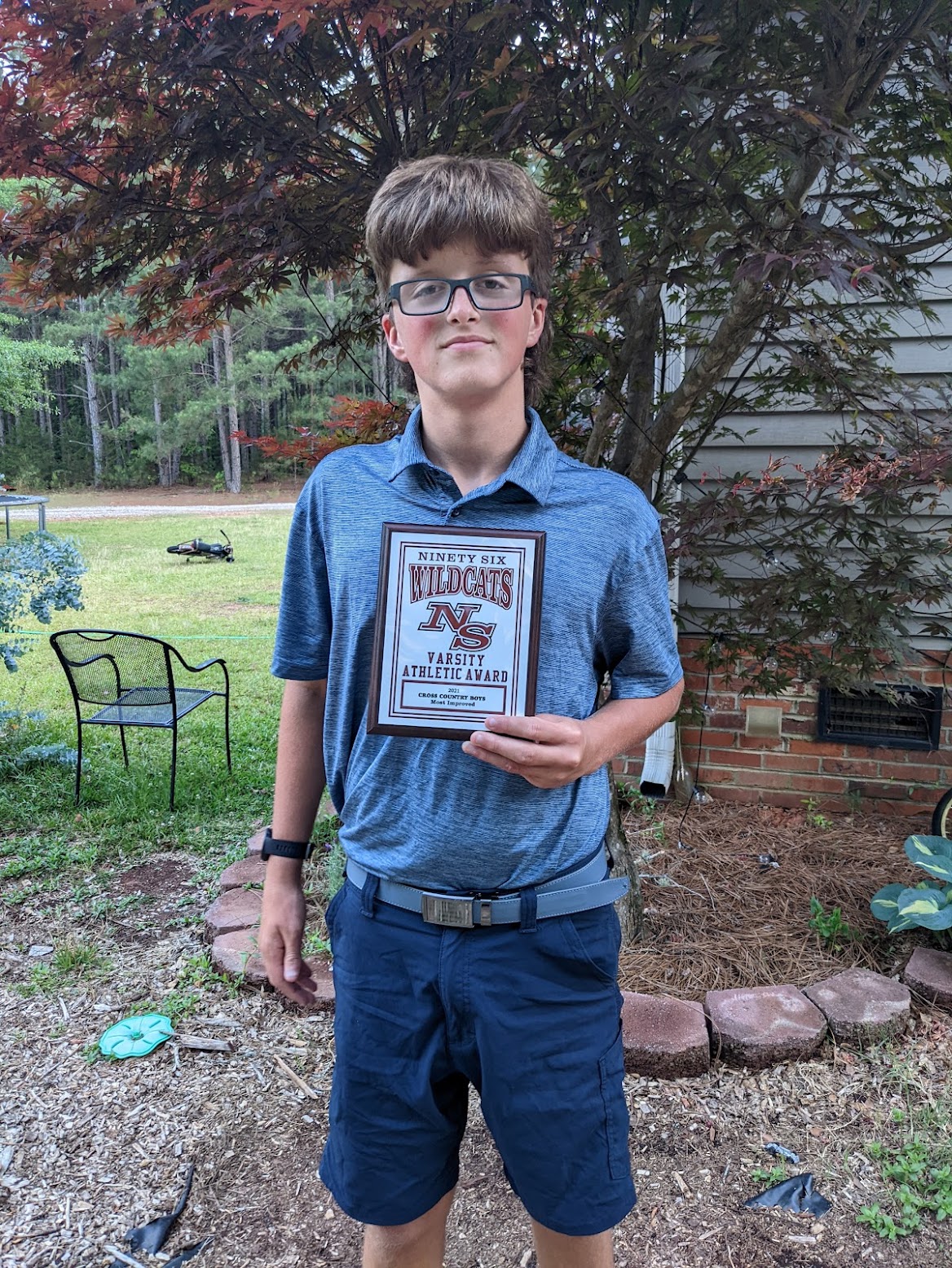 Ben holding his most improved award for XC